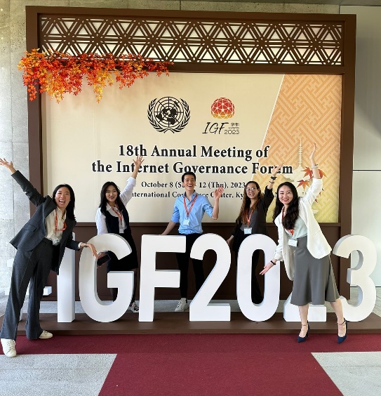 A group of people posing for a photoDescription automatically generated