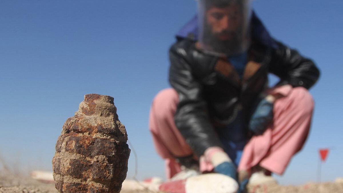 a deminer is deminig the field