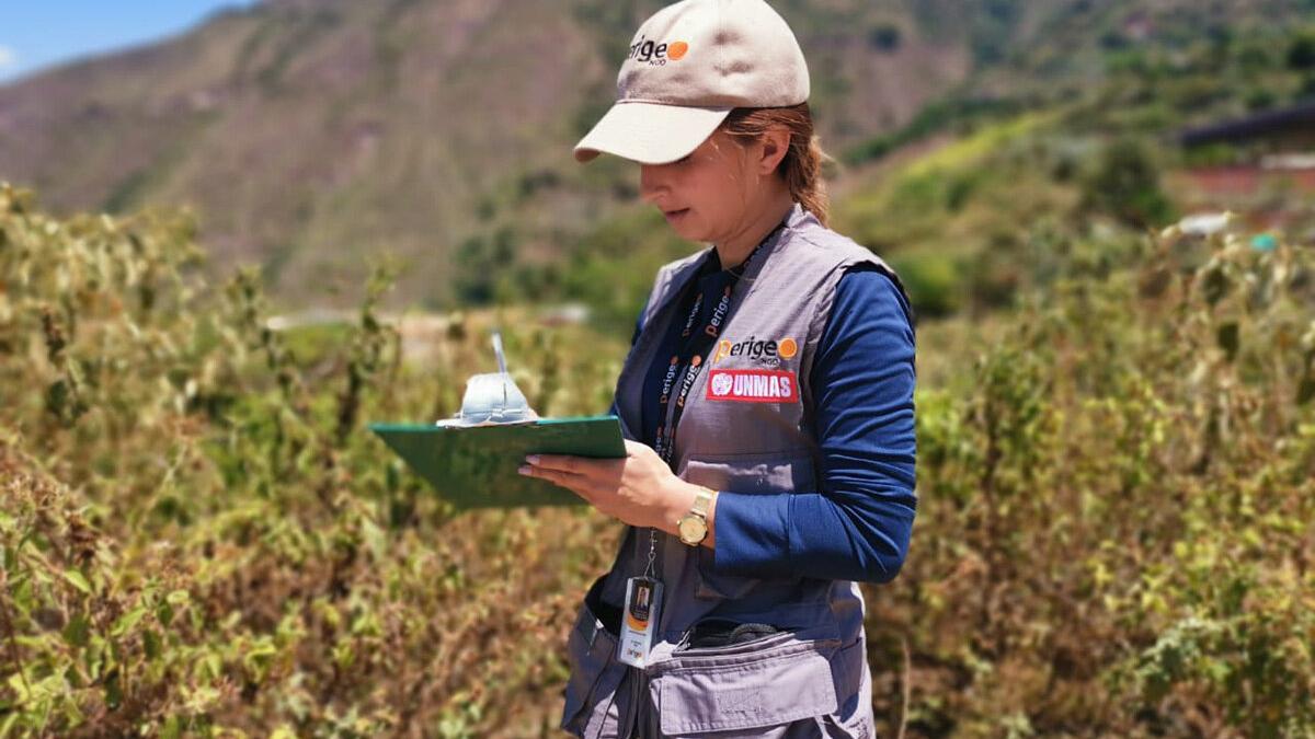 a women with a cap is recording something