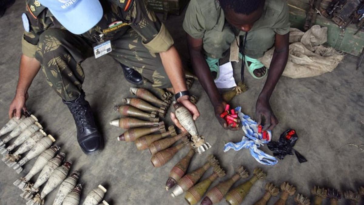 UN peacekeepers examine unexploded ordinance
