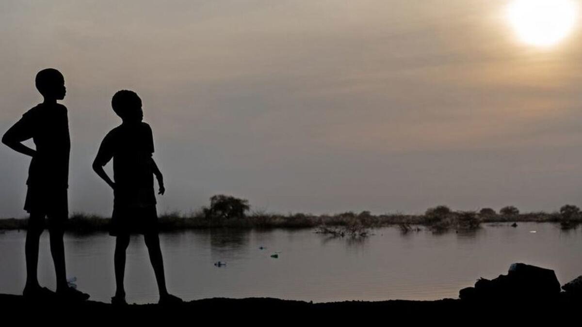 Two silhouettes at sunset.