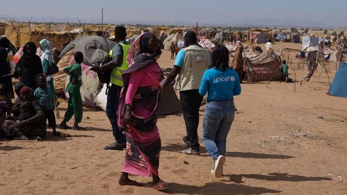 Displaced persons and makeshift shelters at an internally displaced persons camp in Sudan.