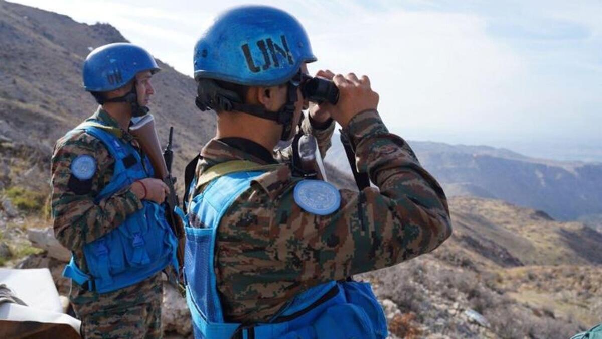 Des soldats de la paix en patrouille.