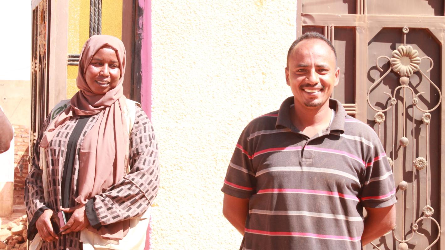 Mr. and Mrs. Ibrahim smile, relieved from the fear of explosive hazard in their yard Mr. and Mrs. Ibrahim smile, relieved from the fear of explosive hazard in their yard