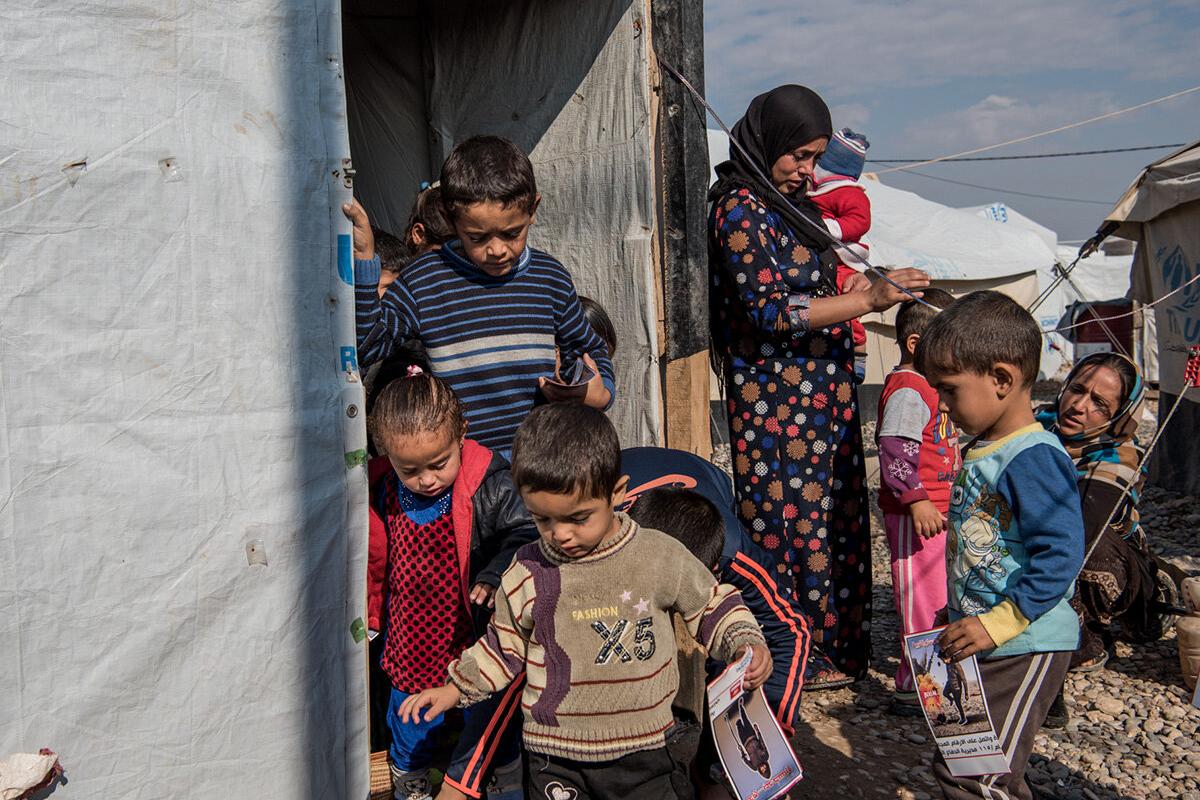 Delivering risk education to refugees and those internally displaced is an essential step to ensure their safe return to their cities and communities. Children leaving a risk education session in Salamiyah IDP camp south east of Mosul, Iraq.