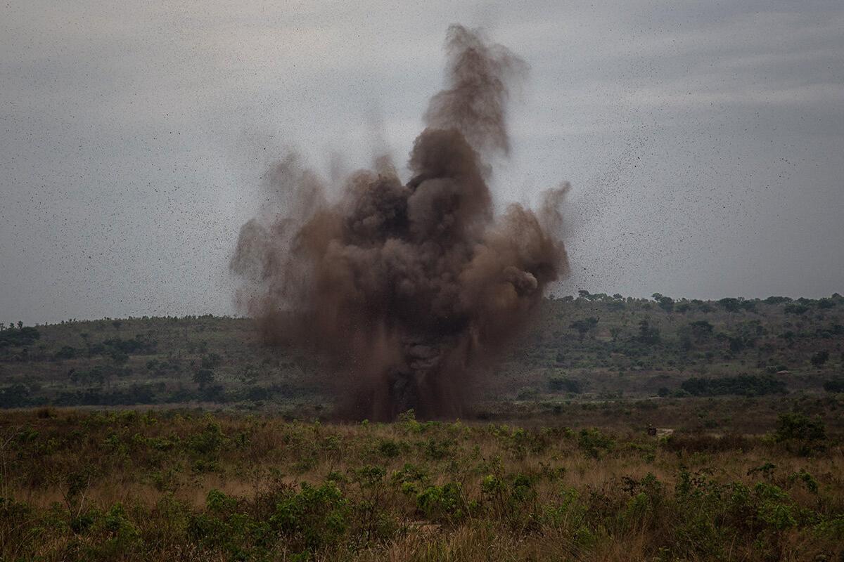 an explosion with smoke in a field