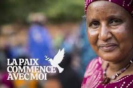 A woman looks into the camera lens