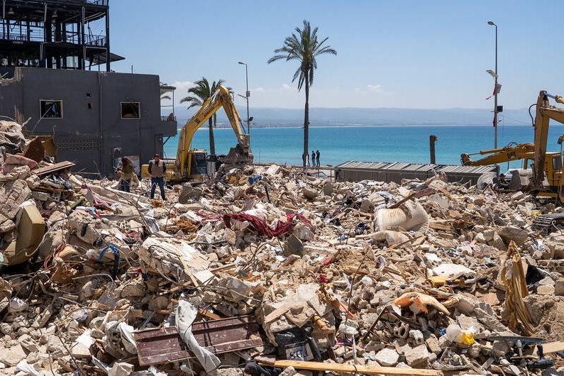 Scenes of widespread destruction are visible in Tyre