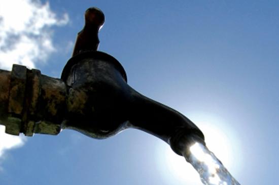 Faucet with water coming out of it.